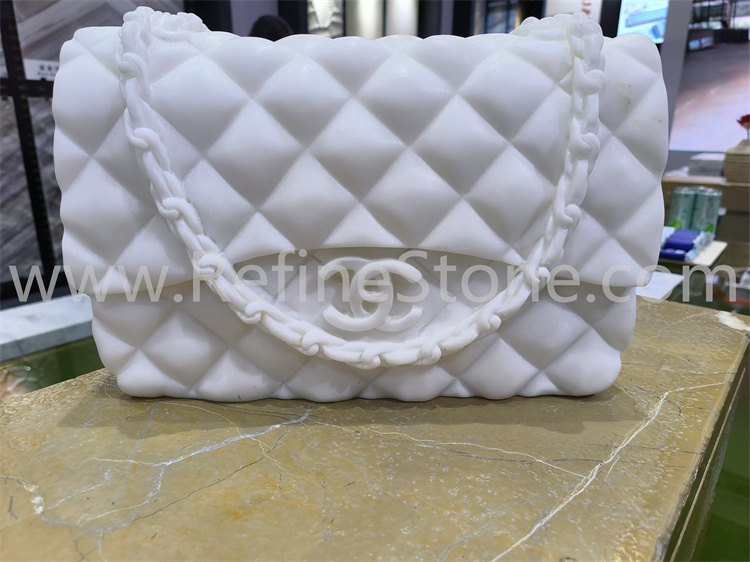 White marble bag sculpture
